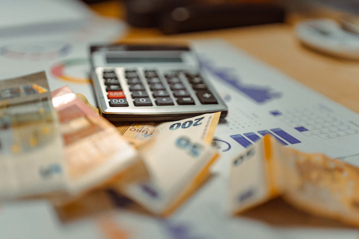 Calculator and money on finance graph